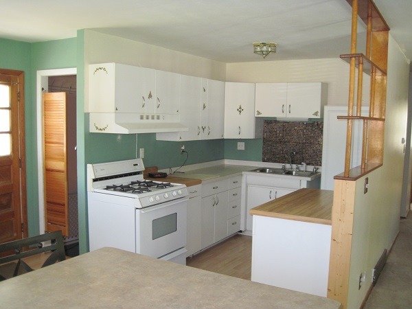 354 Cleveland Avenue Rochelle, IL 61068 - Photo 7 of 22 a kitchen with a stove and a refrigerator