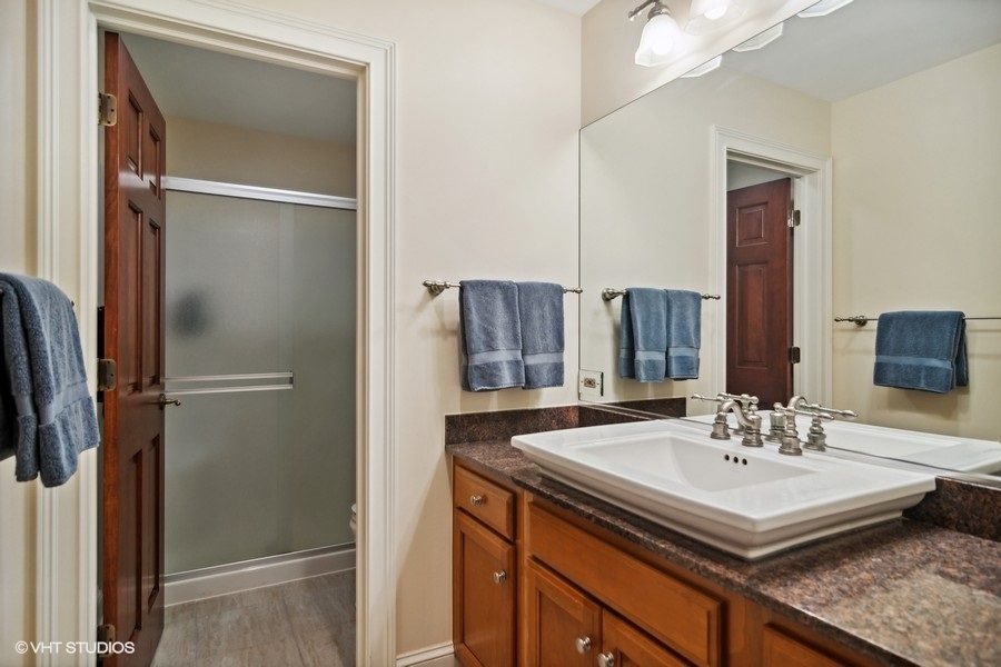 433 Signal Hill Road North Barrington, IL 60010 - Photo 23 of 44 a bathroom with a sink and a mirror