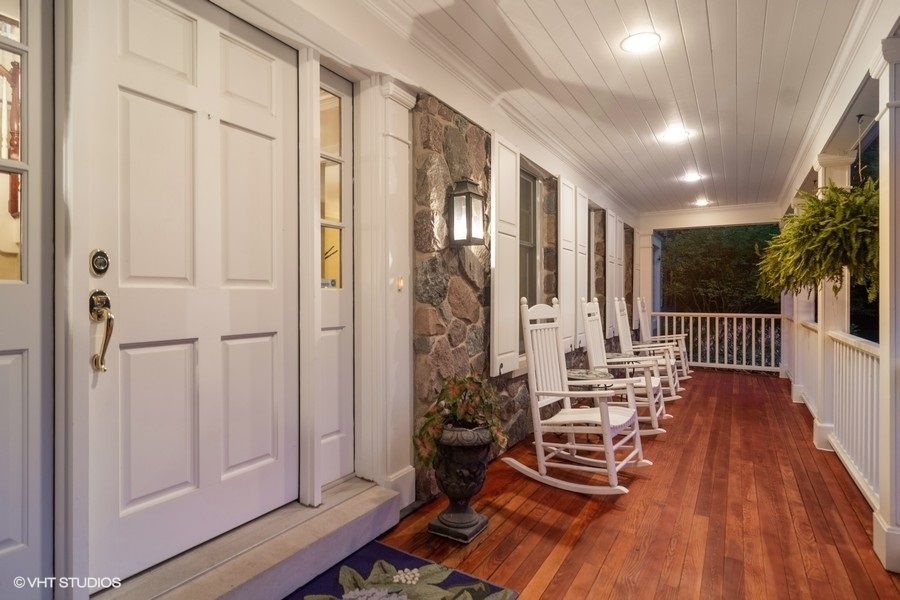 433 Signal Hill Road North Barrington, IL 60010 - Photo 3 of 44 a view of a hallway with wooden floor and stairs