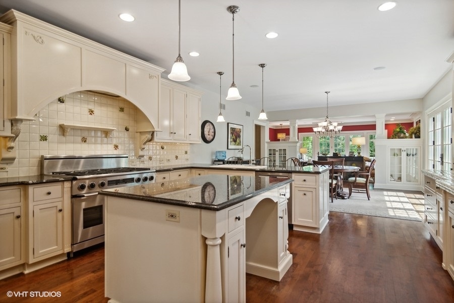 433 Signal Hill Road North Barrington, IL 60010 - Photo 6 of 44 a kitchen with a sink a stove and chairs