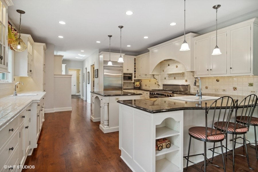 433 Signal Hill Road North Barrington, IL 60010 - Photo 7 of 44 a kitchen with stainless steel appliances kitchen island granite countertop a stove a sink and a refrigerator