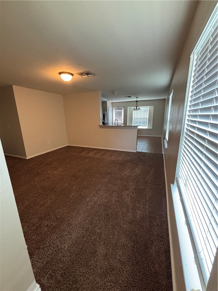 1006 Livermore Street Portland, TX 78374 - Photo 2 of 10 wooden floor in an empty room with a window