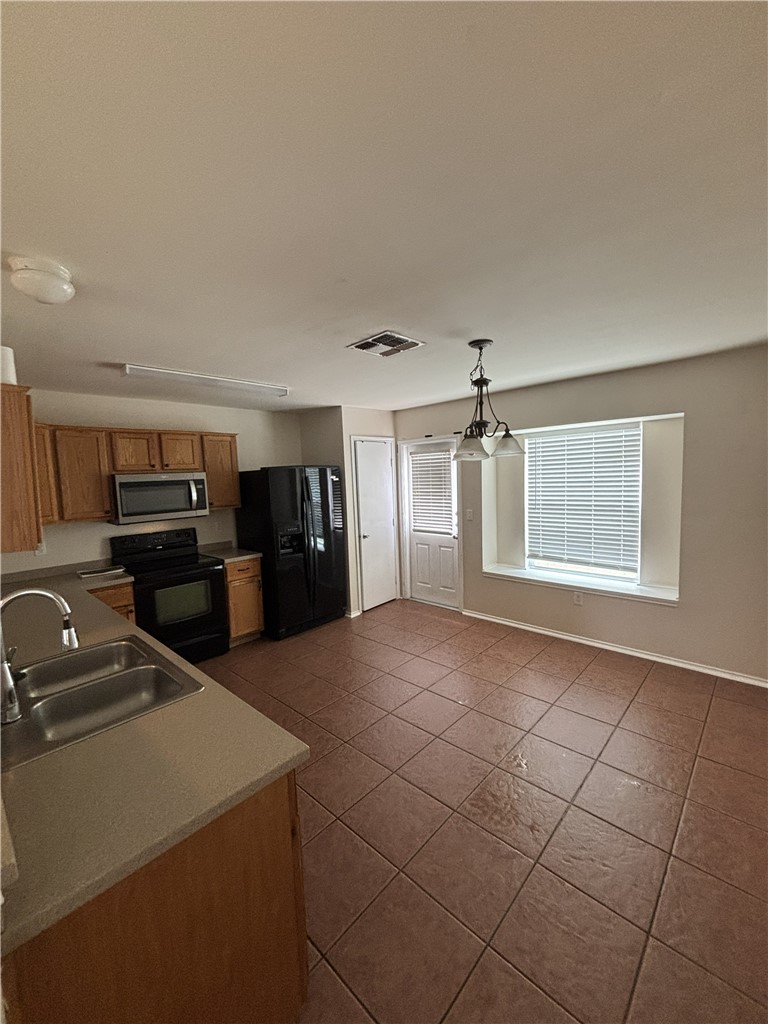1006 Livermore Street Portland, TX 78374 - Photo 3 of 10 a view of a kitchen with a sink