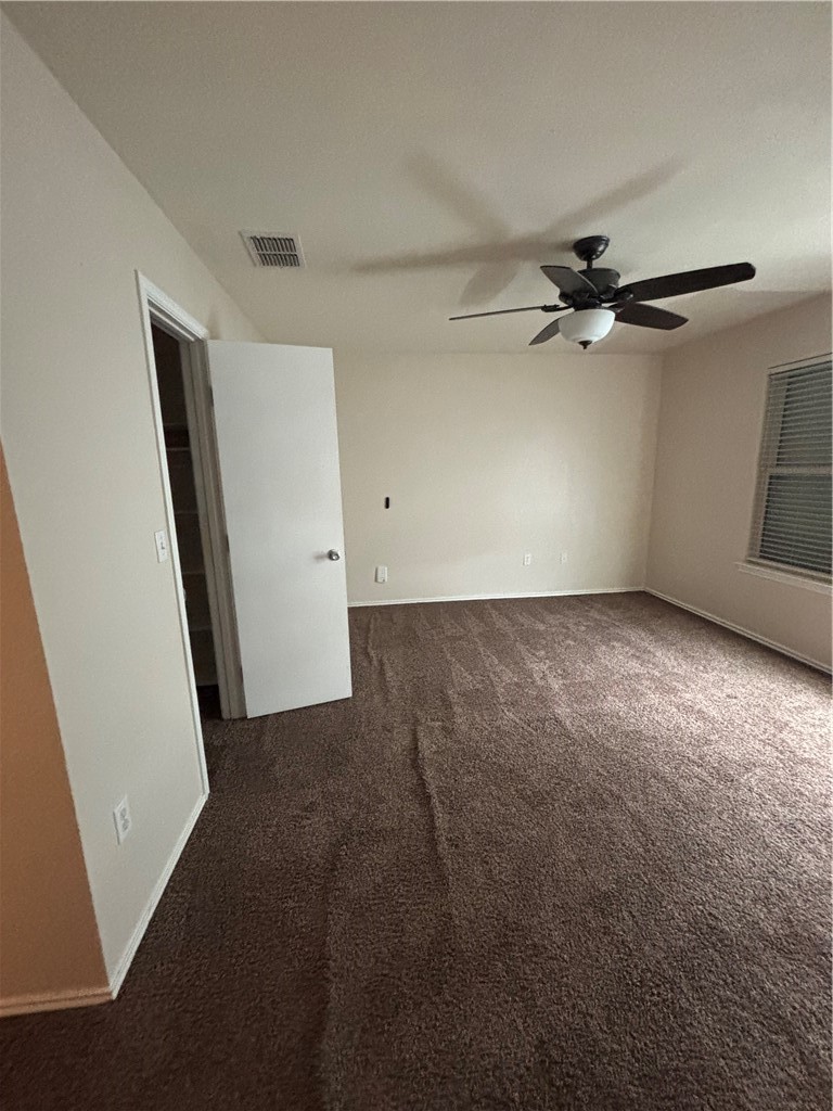 1006 Livermore Street Portland, TX 78374 - Photo 4 of 10 an empty room with a ceiling fan and carpet