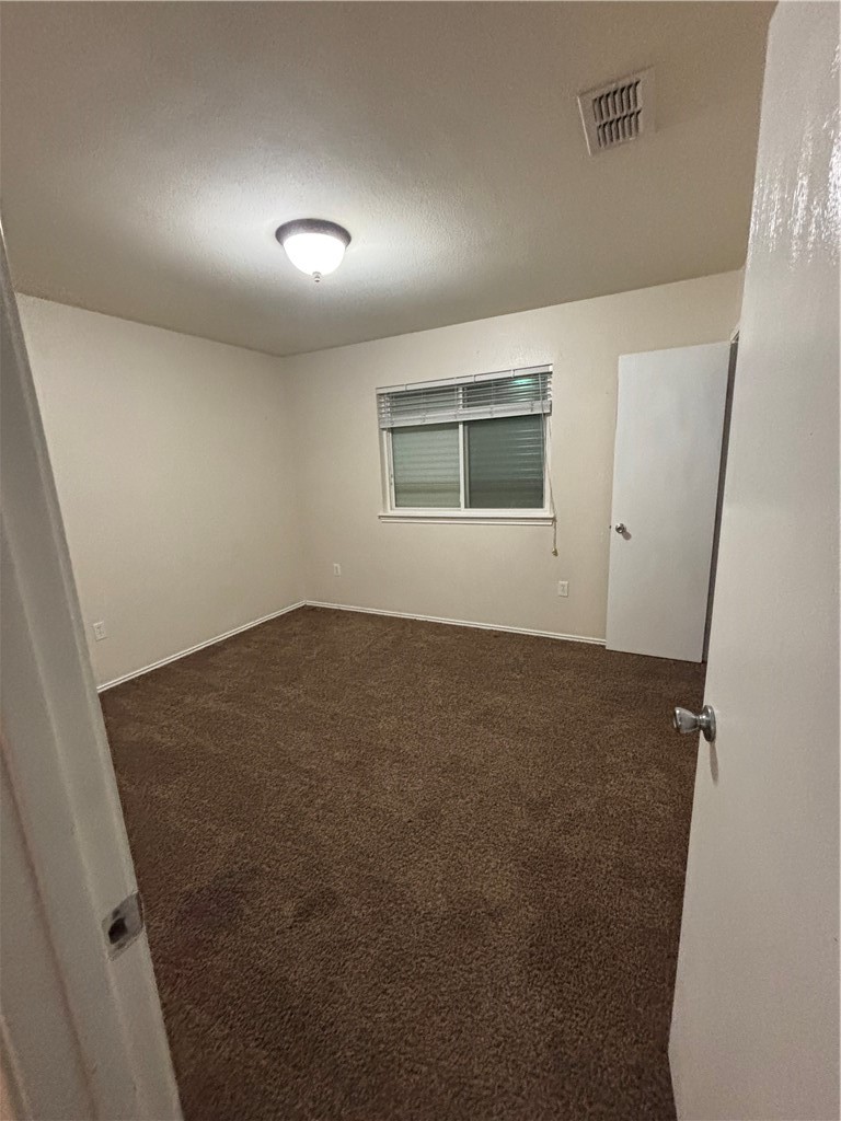 1006 Livermore Street Portland, TX 78374 - Photo 7 of 10 an empty room with windows