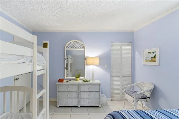 a view of a bedroom with furniture and staircase