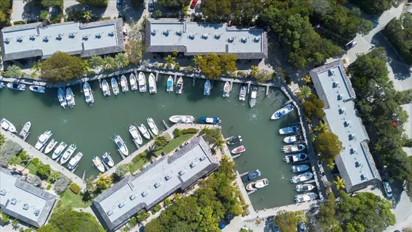 an aerial view of a house with a lake view
