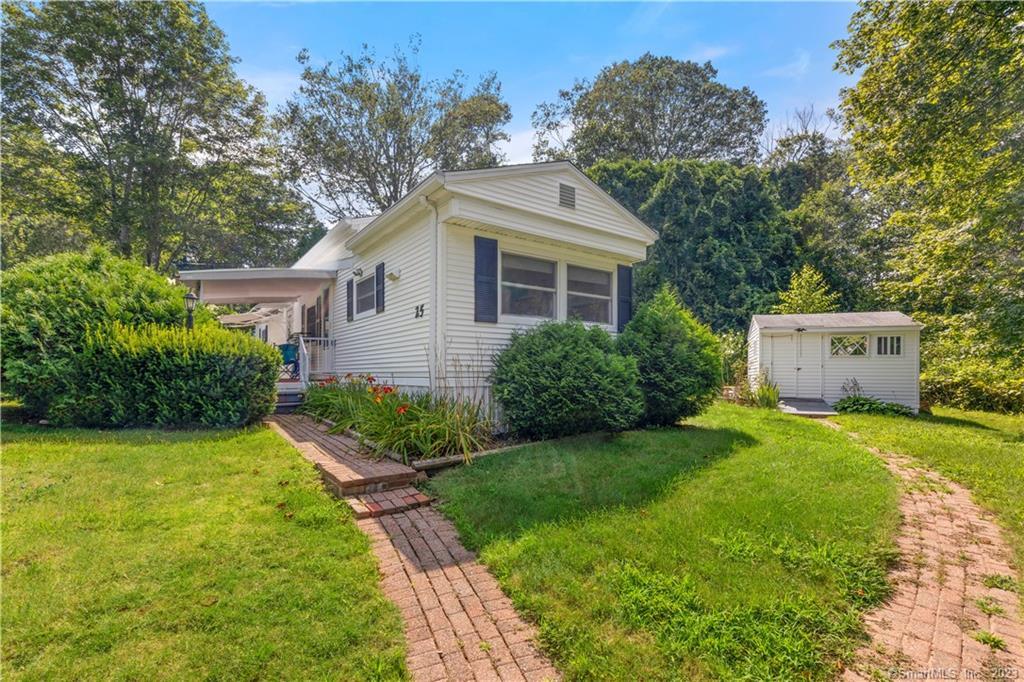 25 Whitewood Road Killingworth, CT 06419 - Photo 1 of 1 a front view of house with yard and green space