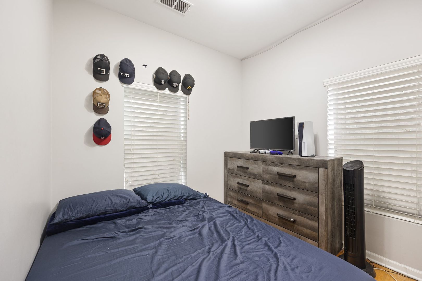 439 Park Street Elgin, IL 60120 - Photo 13 of 20 a bedroom with a bed and flat screen tv