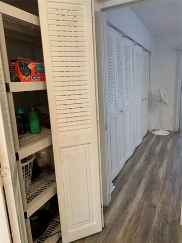 a bathroom with a sink and bathtub with toilet