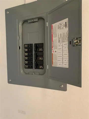 a front view of multiple houses with yard