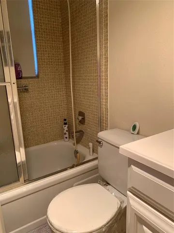 a lobby with gym equipment and a chandelier