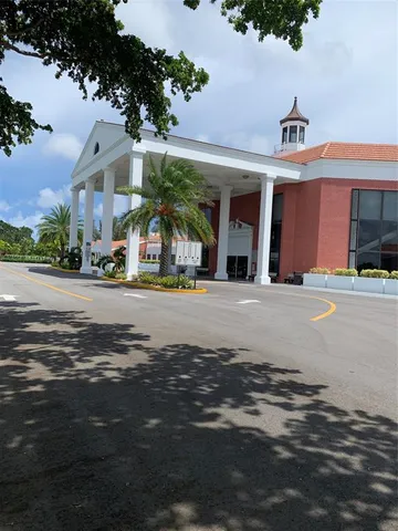 a view of a swimming pool with an outdoor seating
