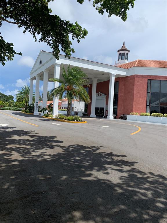 236 Prescott L, Unit 236 Deerfield Beach, FL 33442 - Photo 32 of 61 a view of a building with a street