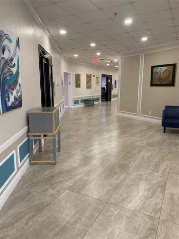 a view of painting on the wall and a living room