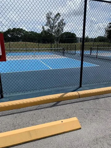 a view of a swimming pool with a table and chairs