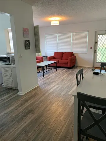 a living room with furniture and a table