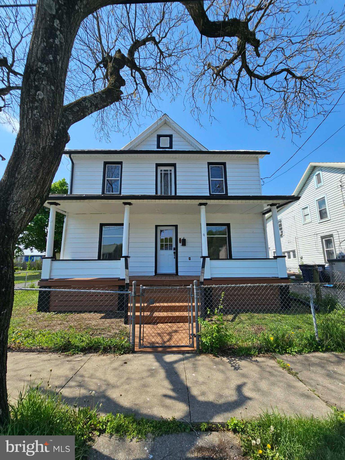 Charming two-story home with porch.