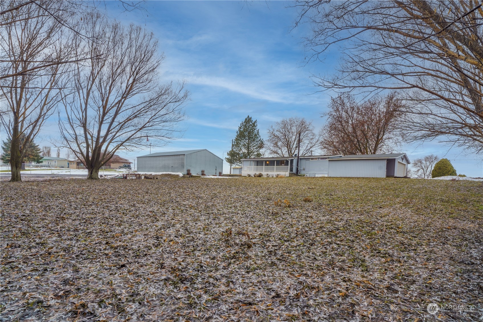 5749 Rd K Northeast Moses Lake, WA 98837 - Photo 4 of 15 a view of road and with trees
