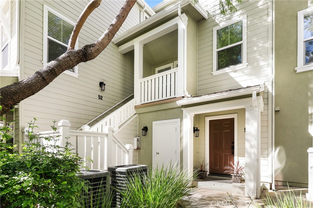52 Valmont Way Ladera Ranch, CA 92694 - Photo 20 of 29 a view of a house with wooden walls and windows