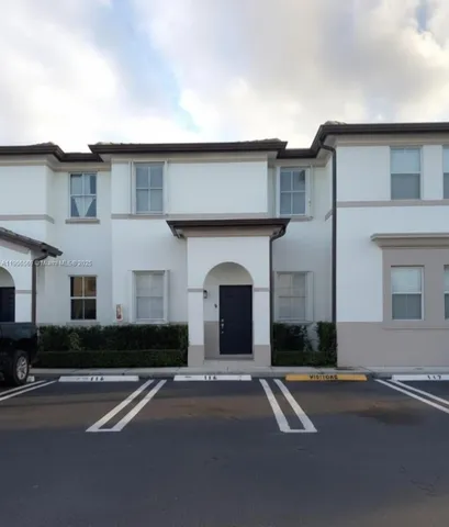 a front view of a house with yard