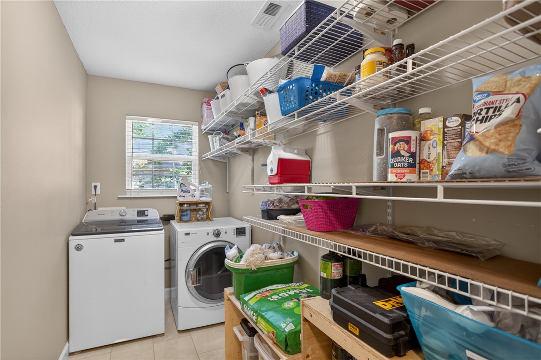 151 Towne Creek Trail Anderson, SC 29621 - Photo 35 of 49 Streamlined laundry area featuring robust shelving for ample storage.
