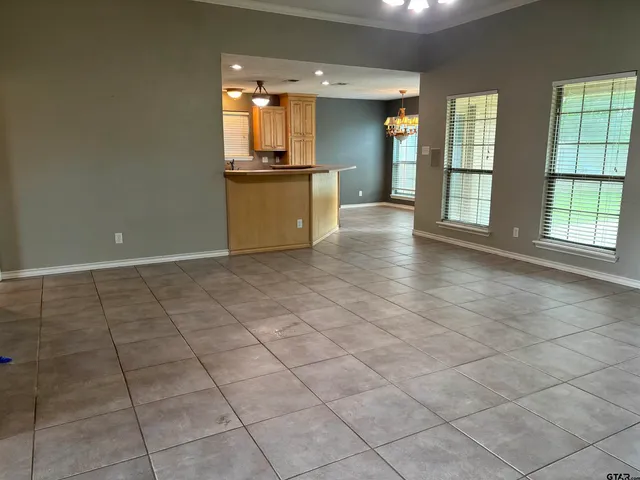 a kitchen with a refrigerator a stove a sink and a microwave