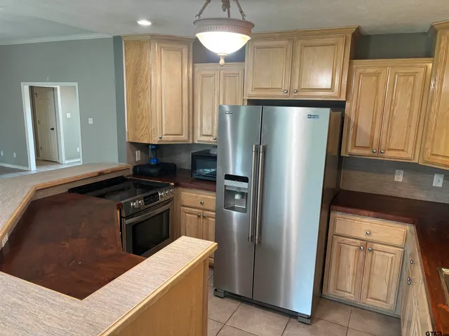a bed sitting in a room next to a window
