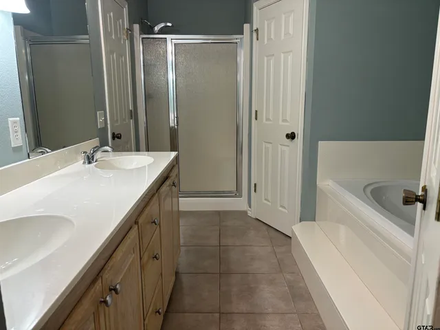 a bathroom with a tub and sink