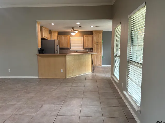 an empty room that has a mirror