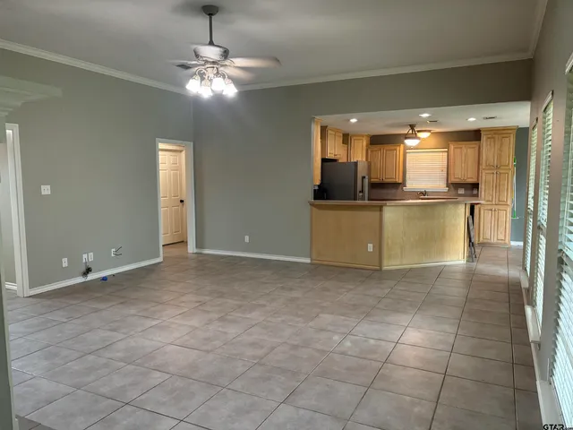a view of a kitchen with a sink and cabinets