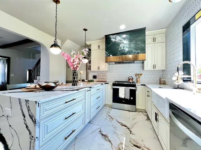 a kitchen with granite countertop a sink stove and cabinets