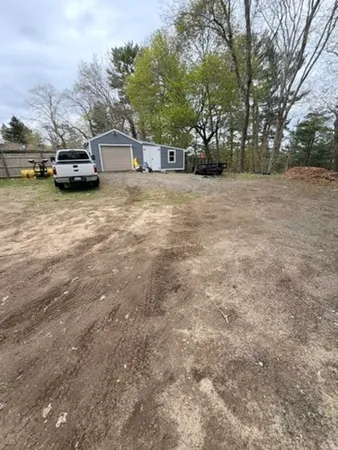 a view of a parking space with parked cars