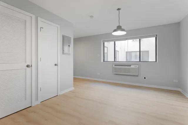 a view of an empty room with a window