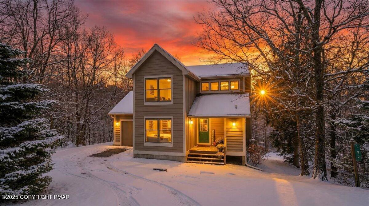 a front view of a house with yard