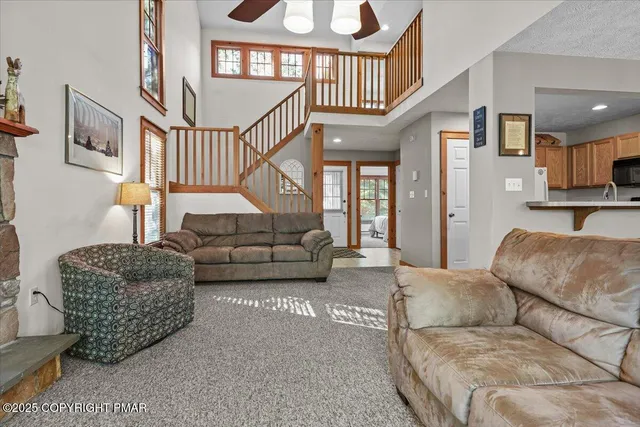 a balcony with wooden floor and deck in the back