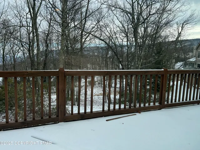 a kitchen with stainless steel appliances granite countertop a sink and a stove