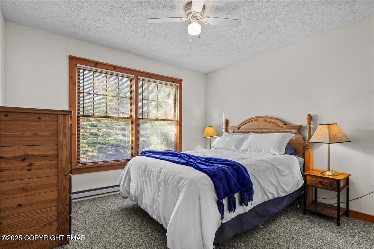 182 Upper Deer Valley Road Tannersville, PA 18372 - Photo 19 of 41 a bedroom with a bed and a window