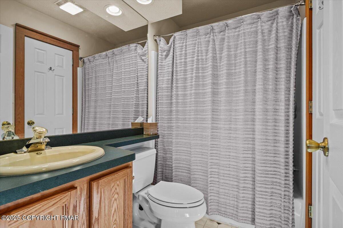 182 Upper Deer Valley Road Tannersville, PA 18372 - Photo 20 of 41 a bathroom with a granite countertop toilet sink and mirror