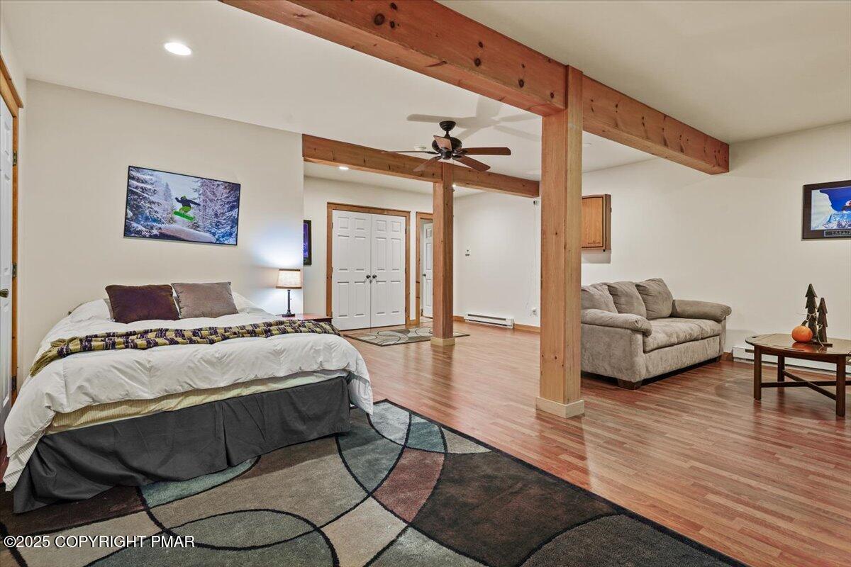 182 Upper Deer Valley Road Tannersville, PA 18372 - Photo 28 of 40 a bedroom with a bed and a couch