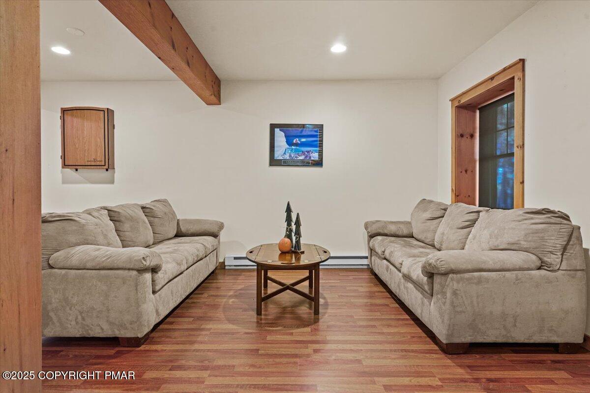 182 Upper Deer Valley Road Tannersville, PA 18372 - Photo 29 of 40 a living room with furniture and a lamp