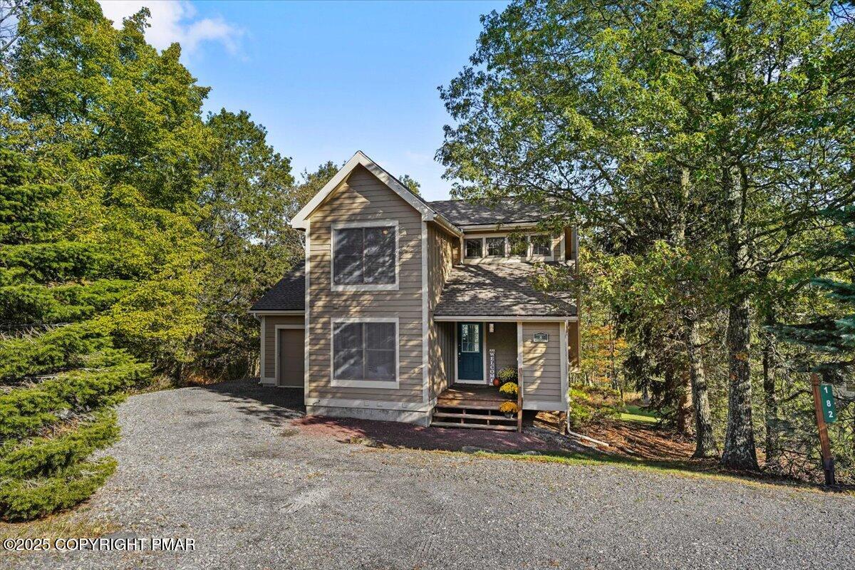 182 Upper Deer Valley Road Tannersville, PA 18372 - Photo 33 of 40 a view of a house with a yard and large tree