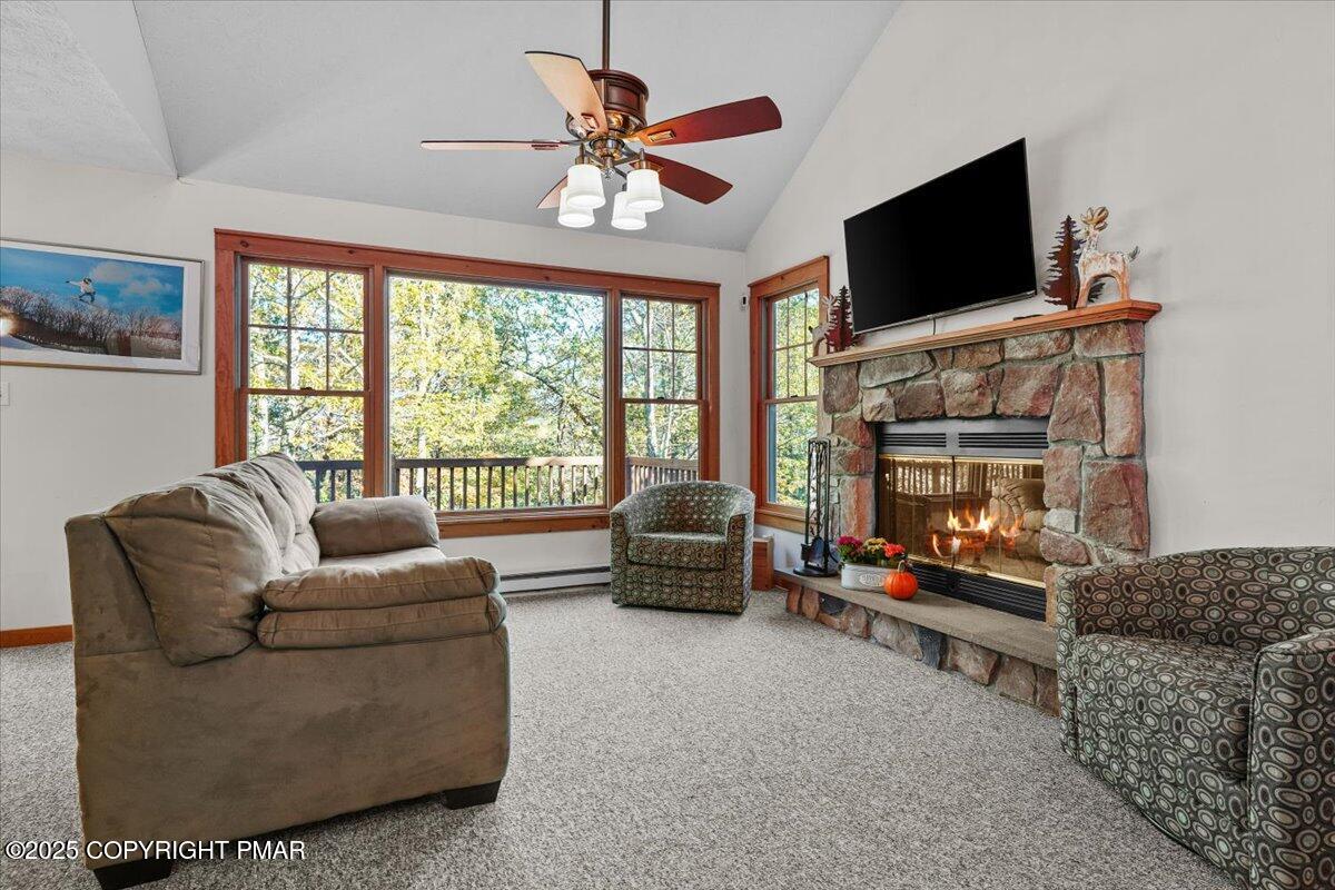 182 Upper Deer Valley Road Tannersville, PA 18372 - Photo 5 of 40 a living room with furniture a flat screen tv and a fireplace
