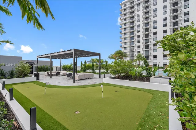 a view of a swimming pool and sitting area