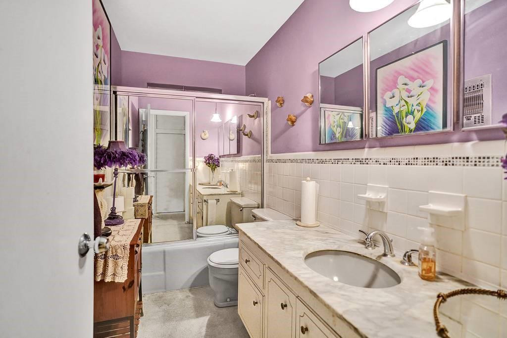 3719 West Park Road Hollywood, FL 33021 - Photo 17 of 24 a bathroom with a granite countertop sink mirror vanity and toilet