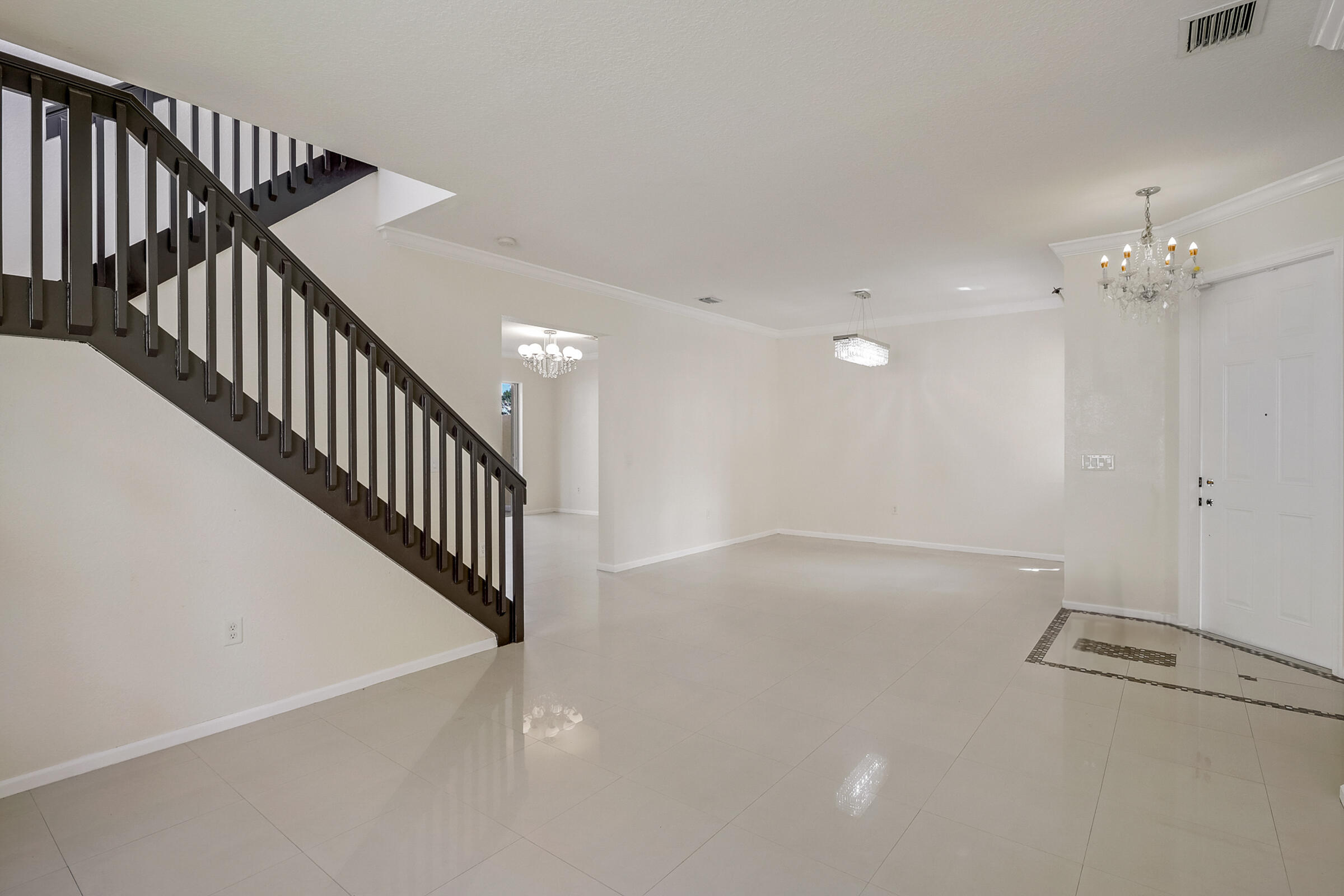 10208 White Water Lily Way Boynton Beach, FL 33437 - Photo 2 of 38 a view of a hallway with staircase