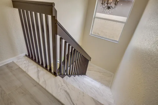 a view of a hallway with windows