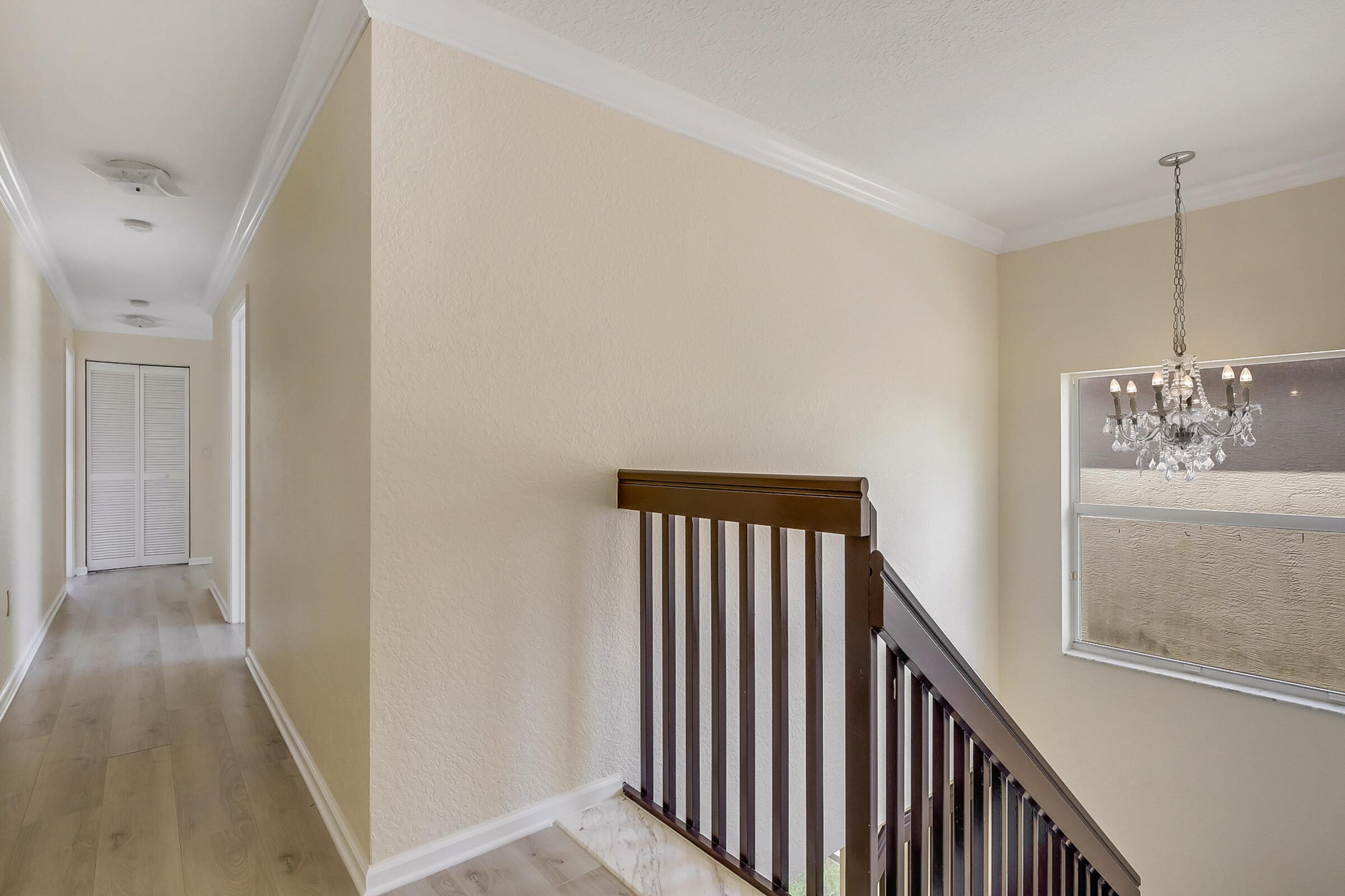 10208 White Water Lily Way Boynton Beach, FL 33437 - Photo 22 of 38 a view of a hallway with windows