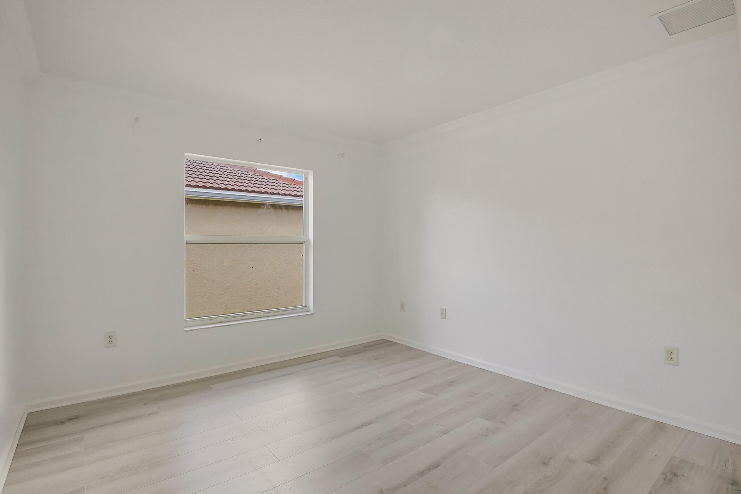 10208 White Water Lily Way Boynton Beach, FL 33437 - Photo 23 of 38 an empty room with a window