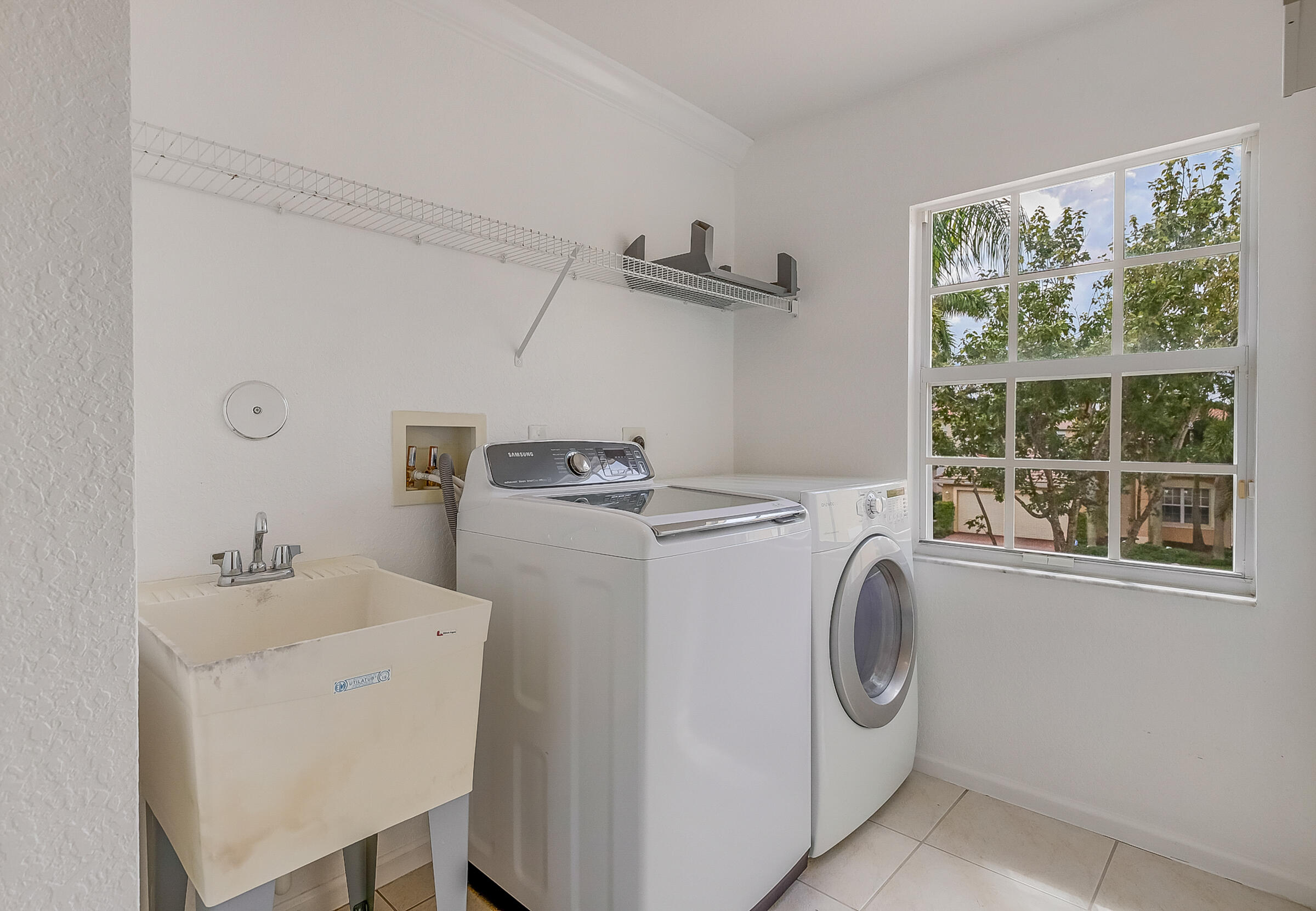10208 White Water Lily Way Boynton Beach, FL 33437 - Photo 29 of 38 a utility room with dryer and washer